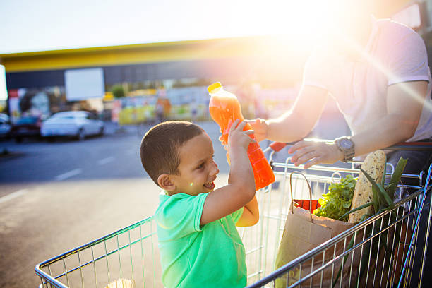 istock Father and son in a grocery shopping 546443782