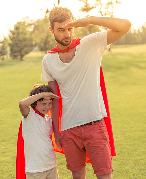 istock Dad and son playing superheroes 546443856
