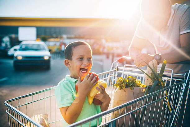 istock Father and son having fun after grocery shopping 546444182