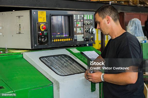 Cnc Turning Machine Operator At Tool Workshop Stock Photo - Download Image Now - Accuracy, Aerospace Industry, Automated