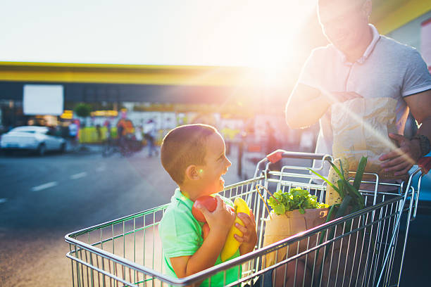 istock Quality time with dad in a grocery shopping 546444568