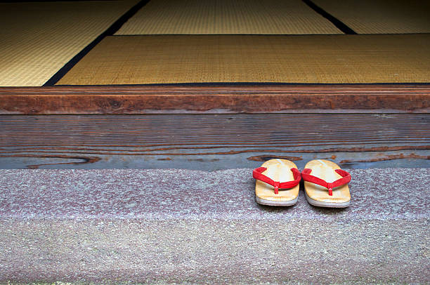 Sandals of red thong on the veranda The red nose is impressive. geta sandal photos stock pictures, royalty-free photos & images