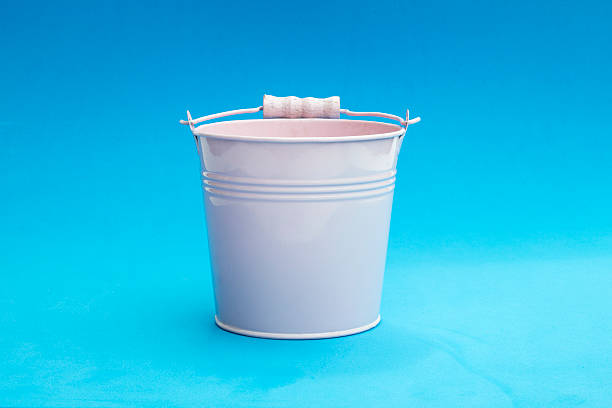 Pink bucket on a blue background