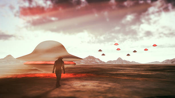 Astronaut walkig towards UFOs on distant alien planet.
