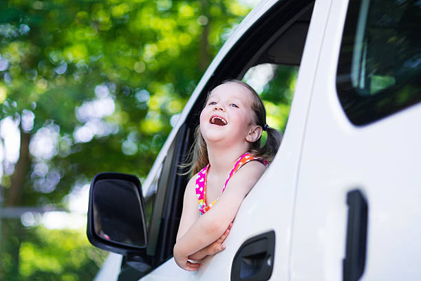 istock Little girl sitting in white car 546449608