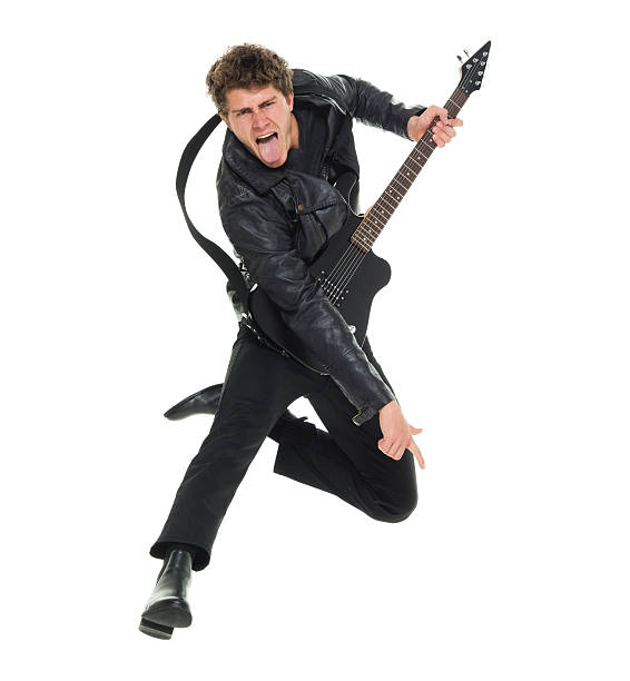 homem casual pulando e tocando guitarra - isolated on white studio shot guitar young men - fotografias e filmes do acervo