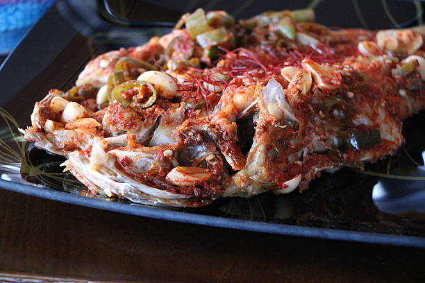 istock lled fish fillet with vegetables in BBQ 546454114