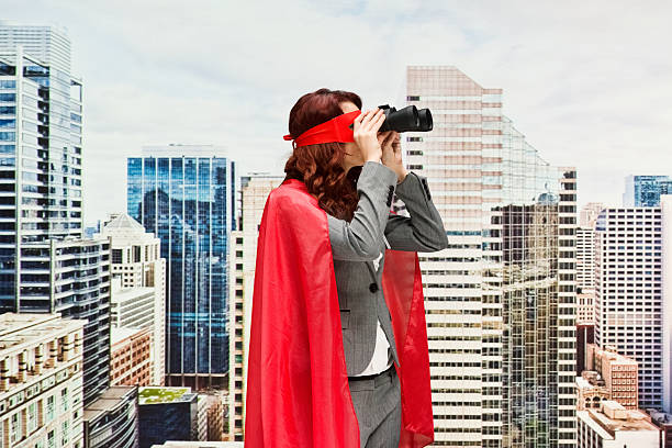 双眼鏡で検索する女性スーパーヒーロー - chicago built structure business forecasting ストックフォトと画像