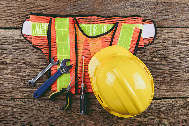 istock Standard construction safety equipment on wooden table 546454756
