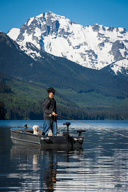 istock Fly fishing with man's best friend 546455312