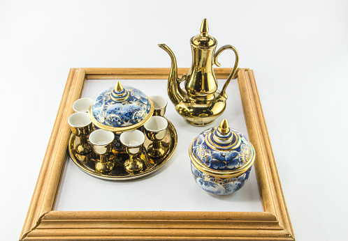 Gold jug Tea glass benjarong in frame on white background