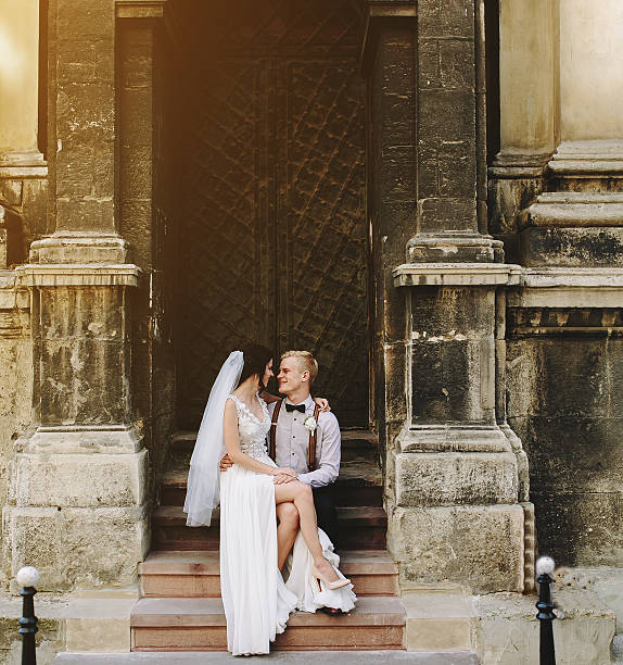 istock Bride sitting on lap of the groom 546458506