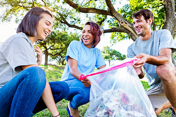 istock Friends clean up their community 546458818
