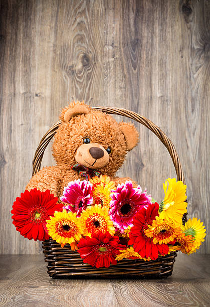 istock Bunch of flowers and a teddy bear 546459188