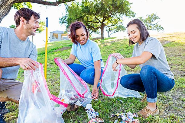 istock Friends clean up park together 546459368