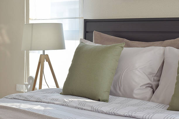 istock modern bedroom with green pillow and decorative lamp 546459778