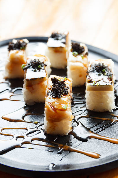 istock Grilled mackerel or saba sushi with black fish roe 546460218