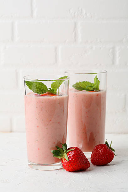 istock strawberry smoothie in two glass 546461126