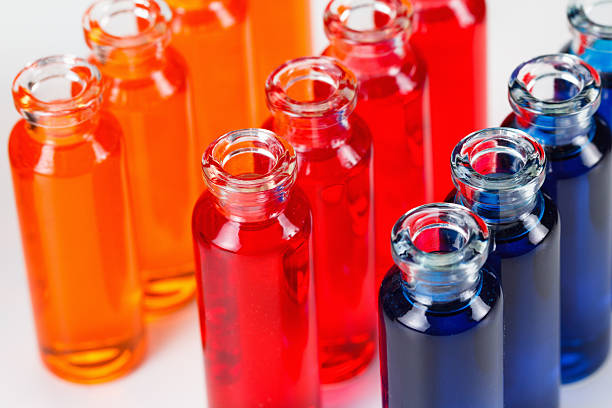 istock Blue, red and orange liquid in chemical lab test tubes 546462072
