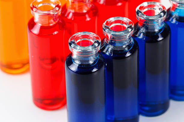 istock Blue, red and orange liquid in chemical lab test tubes 546462222
