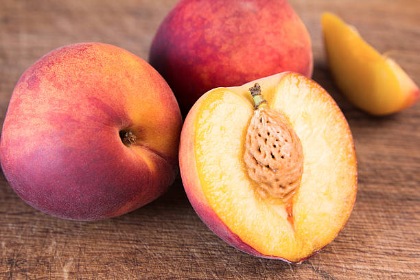 istock Fresh peaches on a wooden cutting board. 546463856