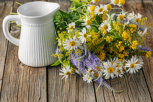 Chamomile flowers on a wooden background. Studio photograp