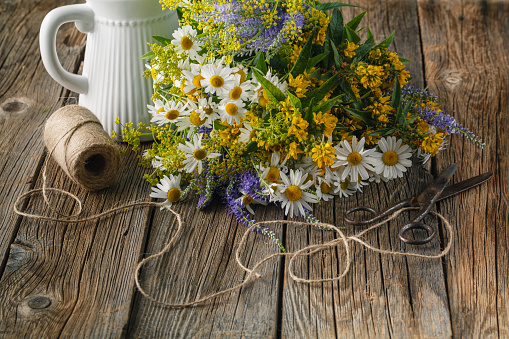 Chamomile flowers on a wooden background. Studio photograp