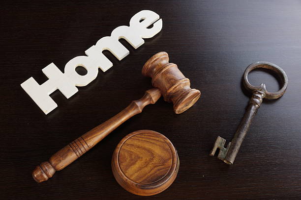 istock Judges Hammer or Gavel With Home Sign On Dark Background 546465610