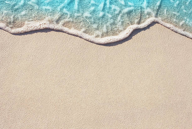 soft wave of ocean on sandy beach - beach stockfoto's en -beelden