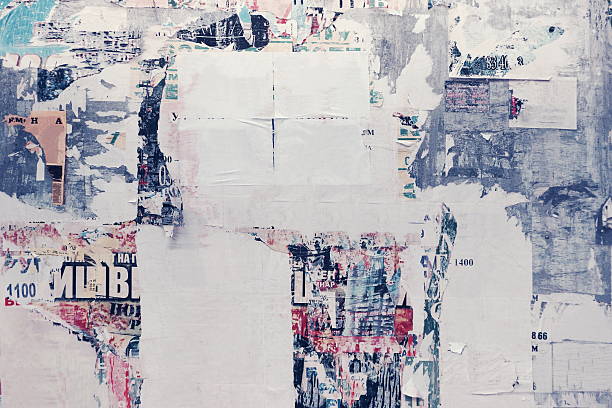 Old Urban Street Billboard With Torn Posters And Stickers