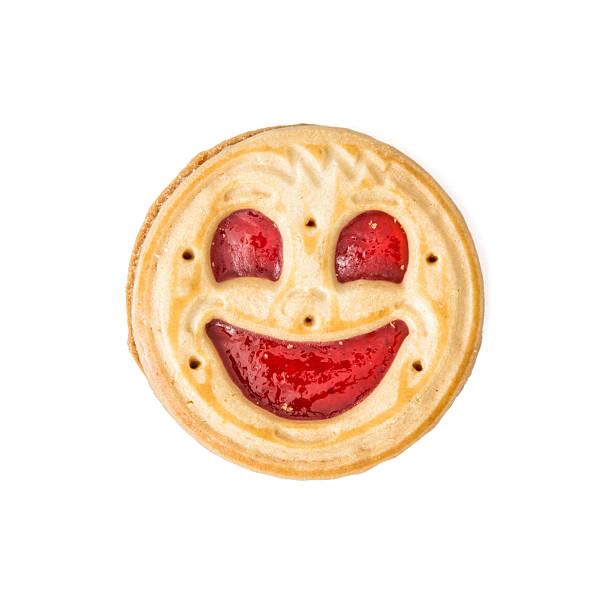 Round biscuit smiling face on the white background stock photo
