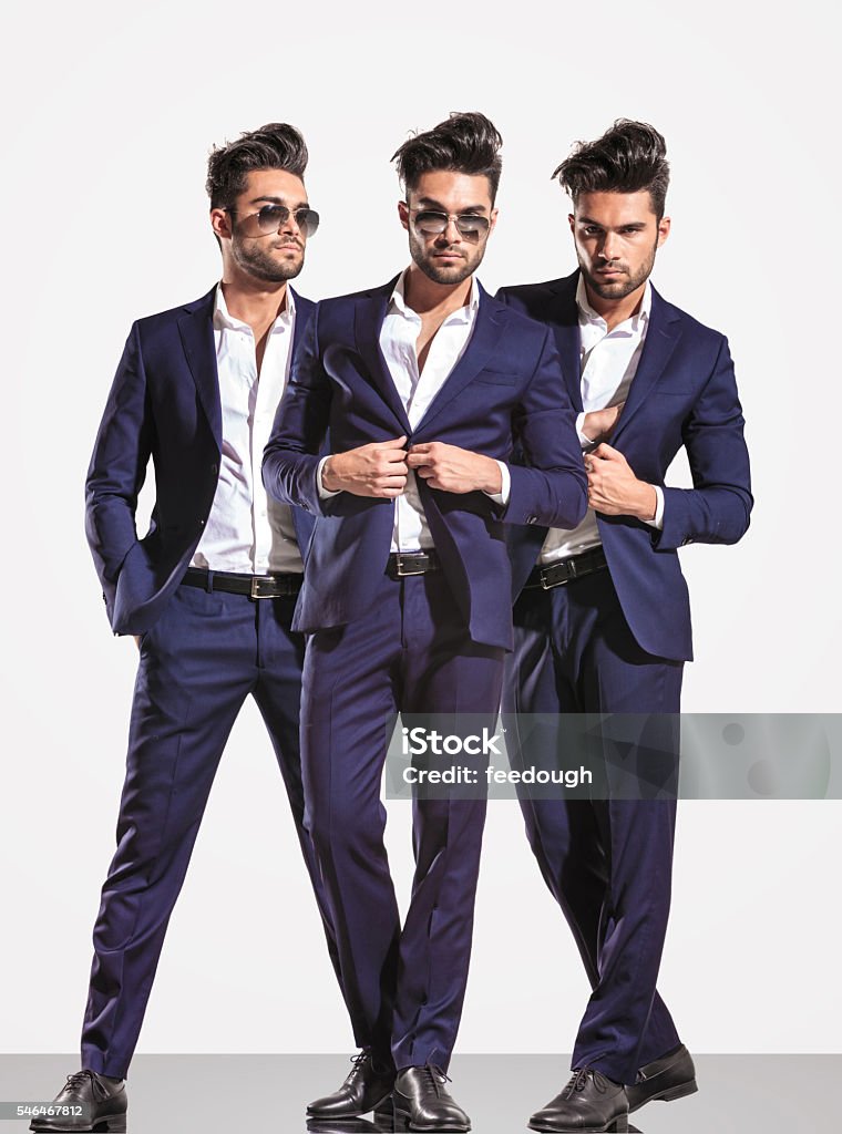 three poses of an elegant smart casual fashion business man three poses of an elegant smart casual fashion business man on light gray background Adult Stock Photo