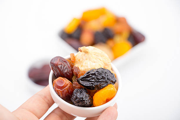 istock Hand presenting collection of Ramadan dried fruits 546468412