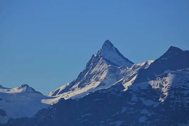 High mountain in the Swiss Alps. Mt Finsteraarhorn. Nature background.