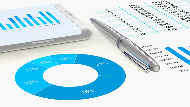 istock Workspace with graphics on paper and smartphone 546761234