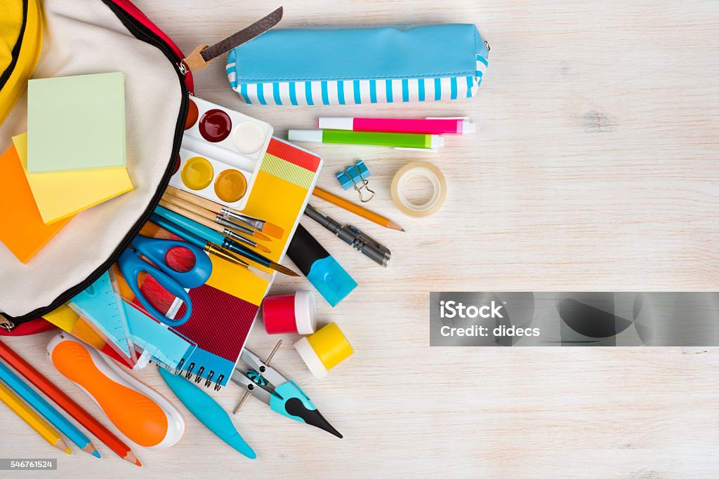 Various stationery school and office supplies over wooden texture background School Supplies Stock Photo