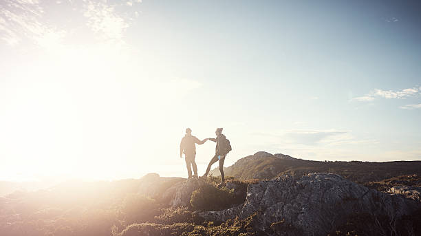 istock Helping each other over the landscape 546763326