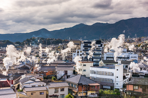 Beppu, Japan cityscape with hot spring bath houses.