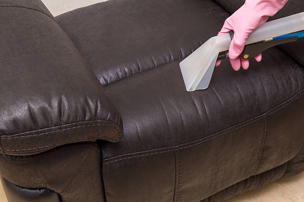 istock Professionally nozzle making free natural leather sofa from dust. 546764920