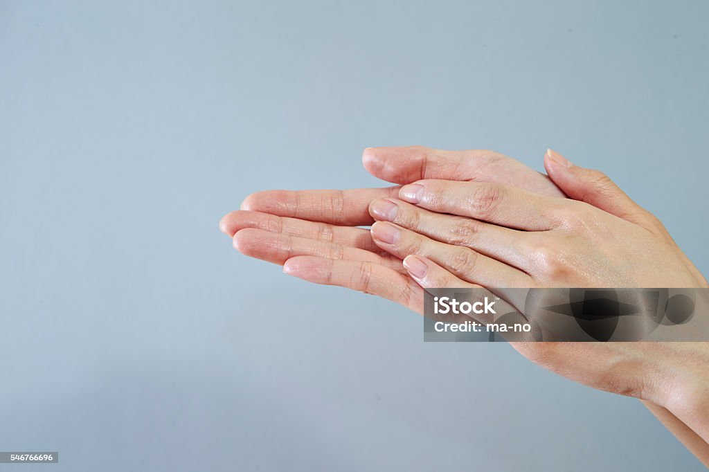 Rubbing hands Rubbing Stock Photo