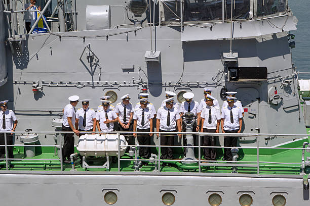 Odesa, Ukraine - July 03, 2016: Crew of warship 'Yuri Olefrienko' stands on their deck of a ship and preparing to meet the President of Ukraine Petro Poroshenko during celebration of NAVY day in Odesa