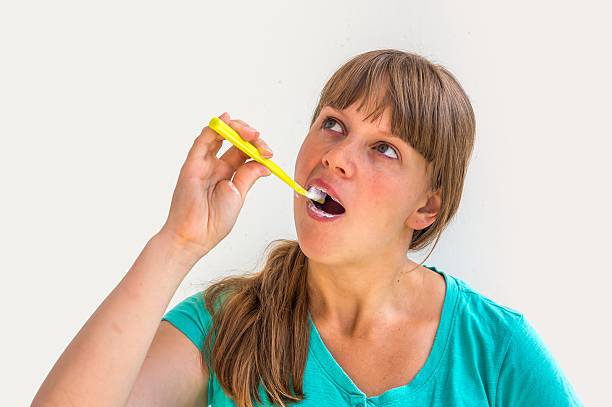 istock Young lady brushing teeth in the morning 546767830
