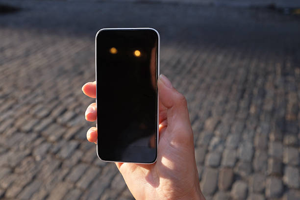 istock Woman's hand holding smart phone 546768922