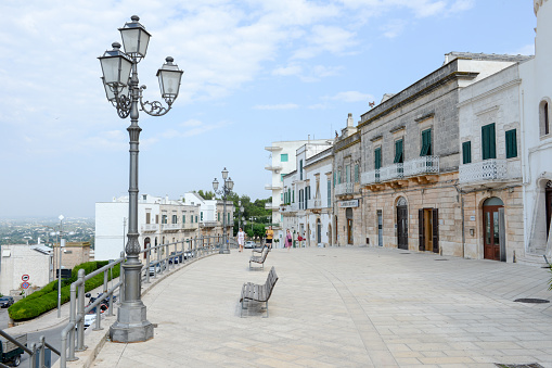 Cisternino, Italy - June 25, 2016: people walking on the main square of Cisternino on Puglia, Italy