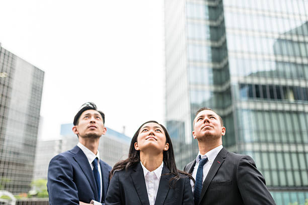 istock Business japanese team standing togetherness 546770796