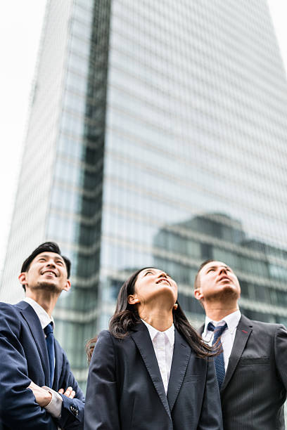 istock Business japanese team standing togetherness 546770954