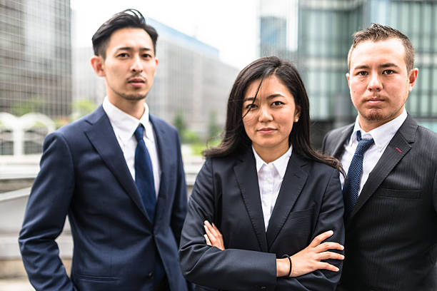 istock Business japanese team standing togetherness 546771146