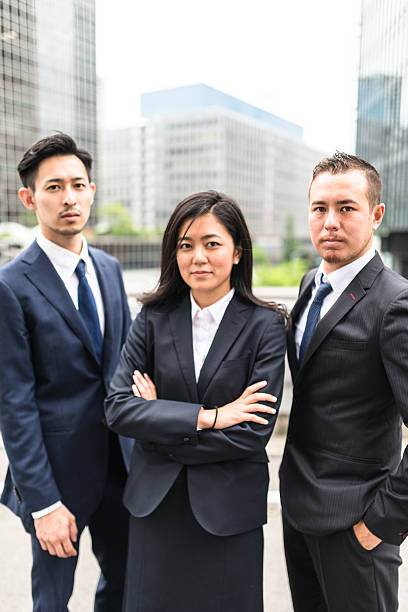 istock Business japanese team standing togetherness 546771280