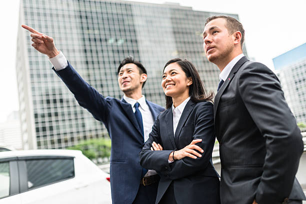 istock Business japanese team standing togetherness 546771494