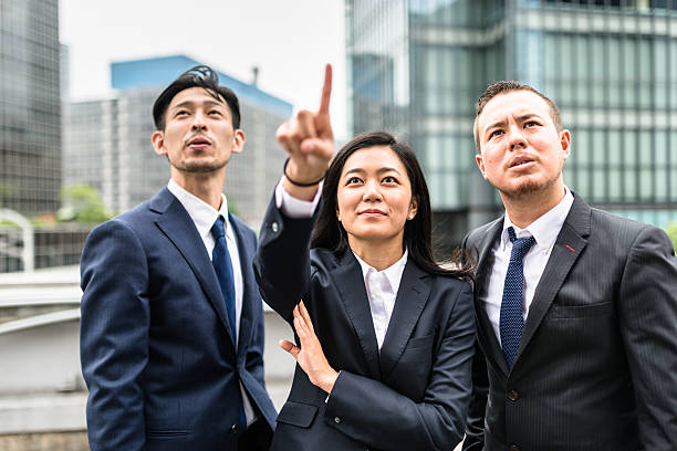 istock Business japanese team standing togetherness 546771562